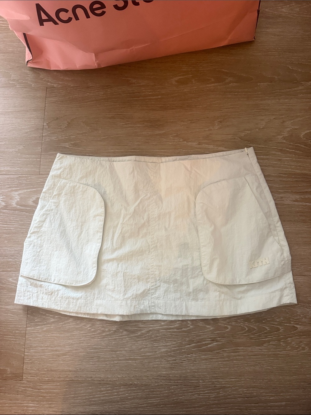 Kith Cream Mini Skirt with Front Patch Pockets